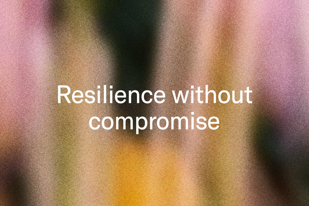 White text "Resilience without compromise" on a blurry, grainy background with vertical streaks of pink, orange, and dark colors.