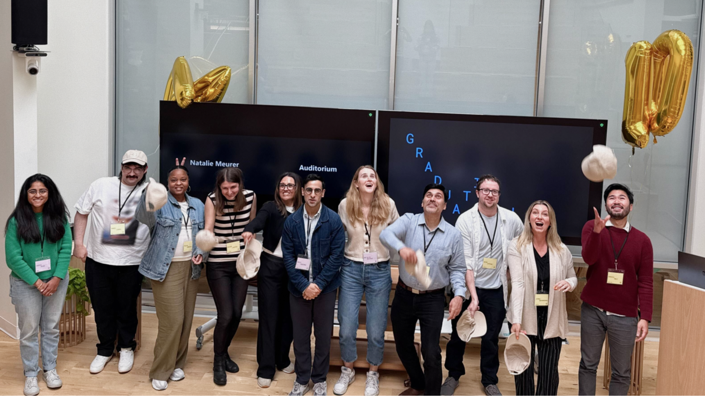 Graduates throwing their hats