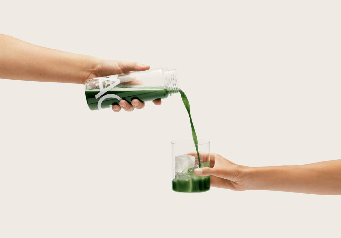 Pouring AG1 into a glass